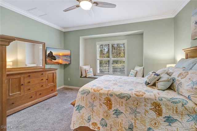 carpeted bedroom with ceiling fan, ornamental molding, and baseboards