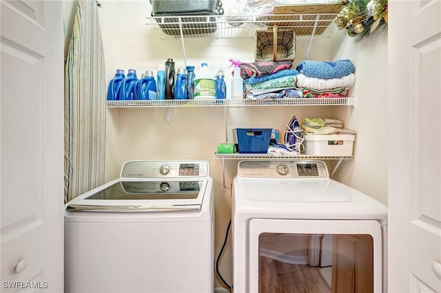 laundry room with laundry area and washer and clothes dryer