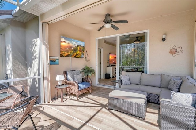 exterior space featuring an outdoor hangout area and ceiling fan