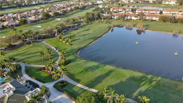 aerial view featuring a residential view, a water view, and golf course view