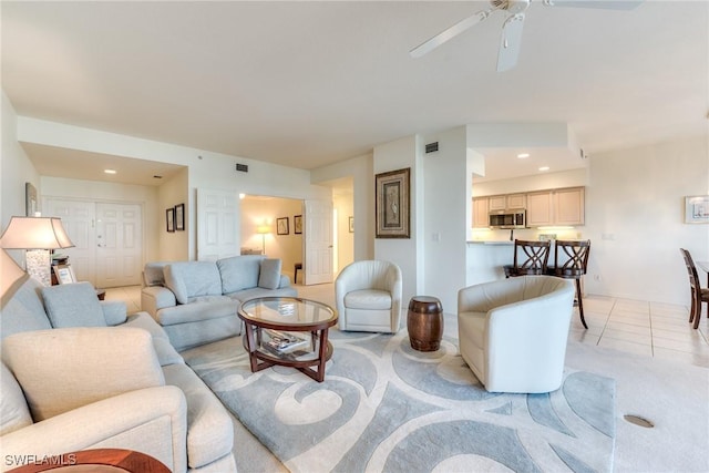 living room with recessed lighting, visible vents, ceiling fan, and light tile patterned floors