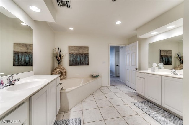 full bath featuring a garden tub, recessed lighting, visible vents, a sink, and tile patterned floors