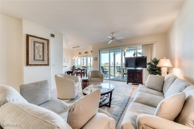 living room featuring visible vents and a ceiling fan