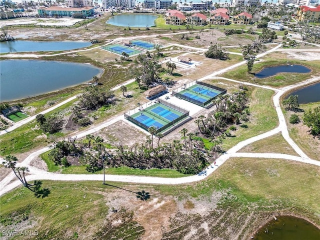 birds eye view of property with a water view