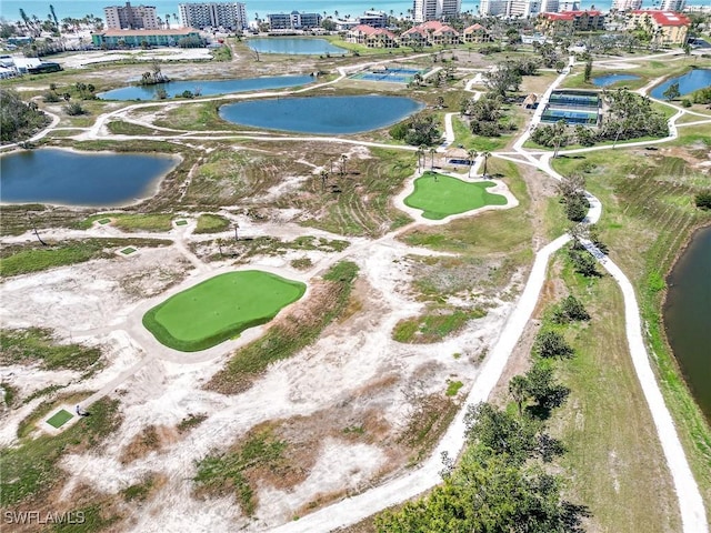 birds eye view of property with a water view and a city view