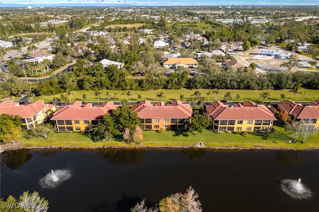 bird's eye view featuring a water view and a residential view