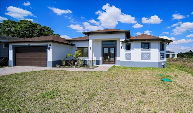 view of front of house featuring a garage, decorative driveway, french doors, a front lawn, and stucco siding