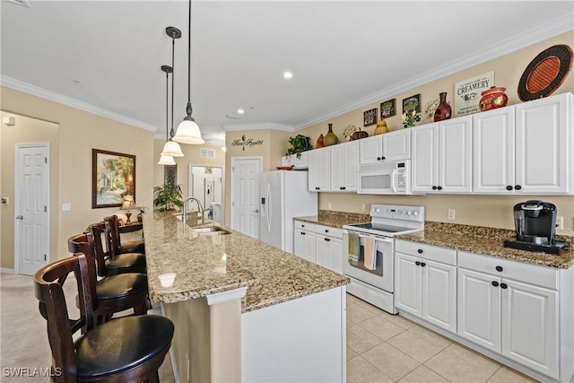 kitchen with white appliances, a sink, white cabinetry, and crown molding