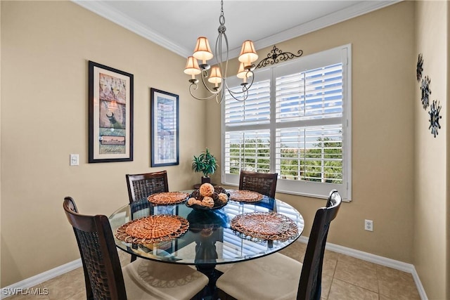 dining space featuring a chandelier, ornamental molding, baseboards, and light tile patterned floors