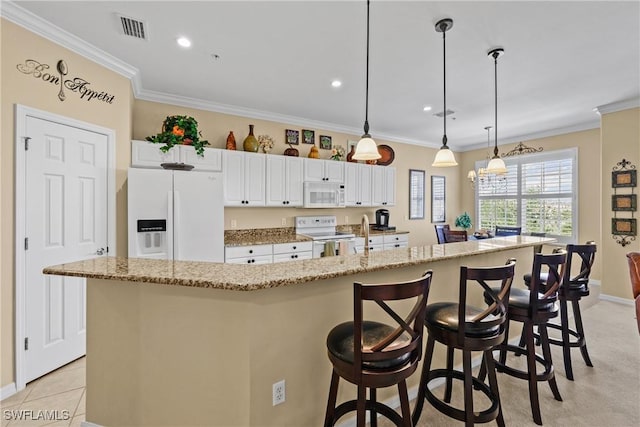 kitchen with white appliances, visible vents, and ornamental molding