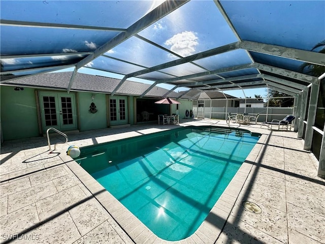 view of pool with a fenced in pool, french doors, a patio area, and fence