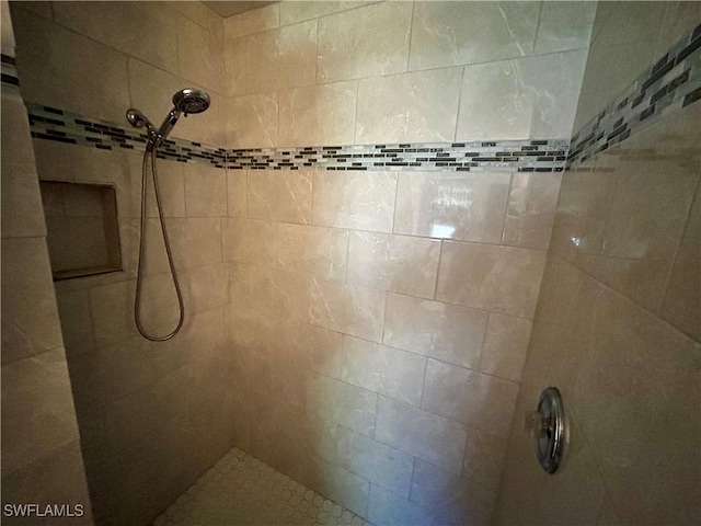 room details with a tile shower