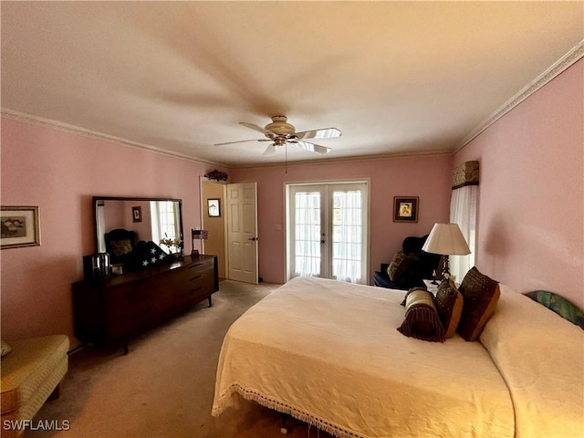 carpeted bedroom featuring ornamental molding, ceiling fan, and french doors