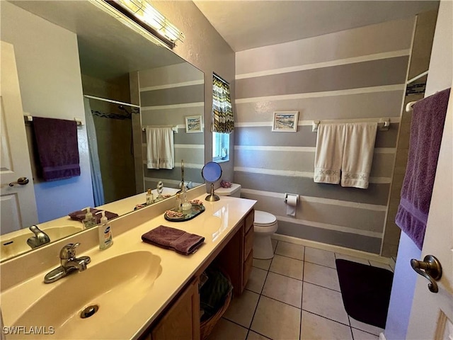 full bathroom featuring a shower with shower curtain, vanity, toilet, and tile patterned floors