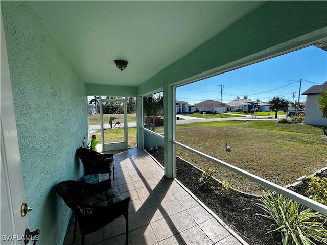 sunroom with a residential view