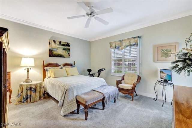 bedroom featuring carpet floors, ornamental molding, baseboards, and a ceiling fan