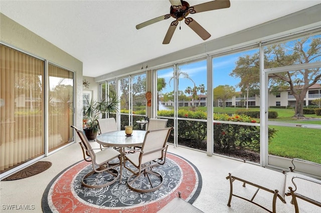 sunroom featuring ceiling fan