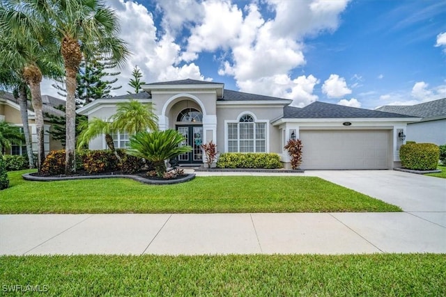 mediterranean / spanish-style house with concrete driveway, a front lawn, an attached garage, and stucco siding