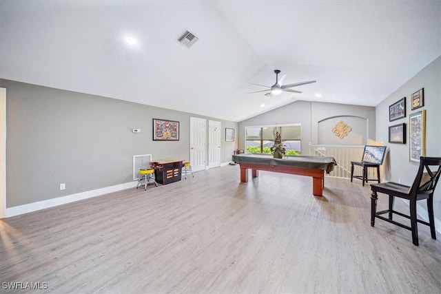 rec room featuring lofted ceiling, wood finished floors, visible vents, and baseboards