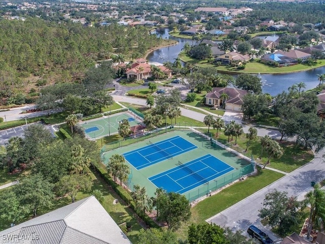 drone / aerial view featuring a water view and a residential view