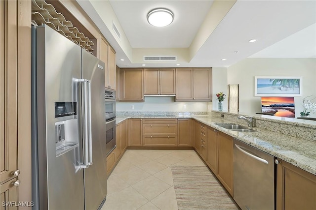 kitchen with light tile patterned floors, visible vents, light stone counters, stainless steel appliances, and a sink