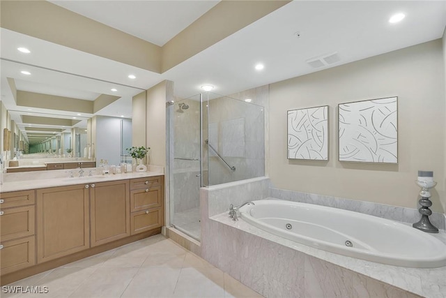 bathroom with vanity, a jetted tub, a shower stall, and visible vents