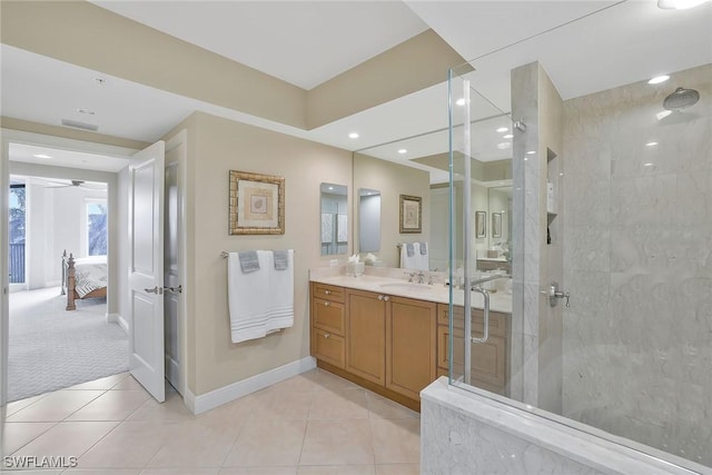 full bath with baseboards, an enclosed shower, tile patterned flooring, and vanity