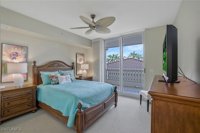 bedroom featuring light carpet, access to exterior, and a ceiling fan