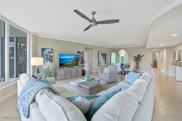 living room with light tile patterned floors, ceiling fan, baseboards, and crown molding