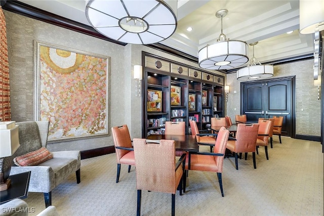 carpeted dining room featuring ornamental molding, beam ceiling, and baseboards