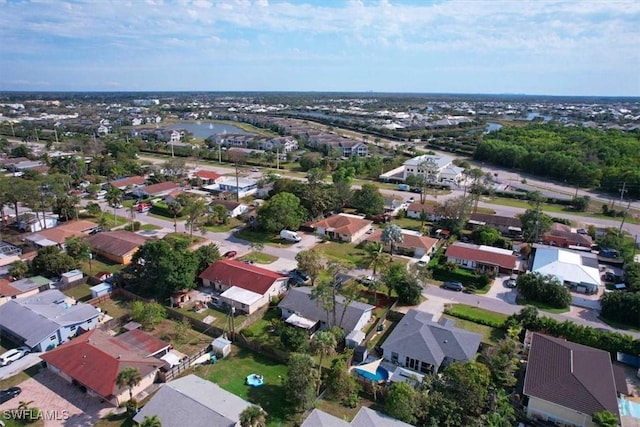 birds eye view of property with a residential view and a water view