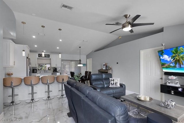 living area with marble finish floor, visible vents, vaulted ceiling, and ceiling fan