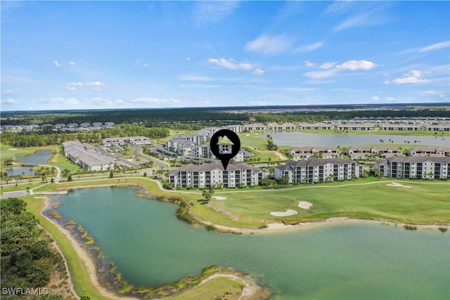 aerial view with view of golf course and a water view