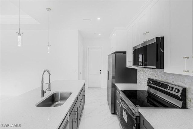 kitchen with a sink, white cabinets, marble finish floor, appliances with stainless steel finishes, and backsplash