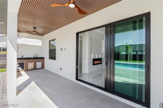 view of patio / terrace with ceiling fan