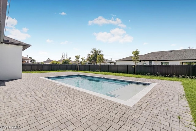 view of pool with a fenced backyard, a fenced in pool, and a patio