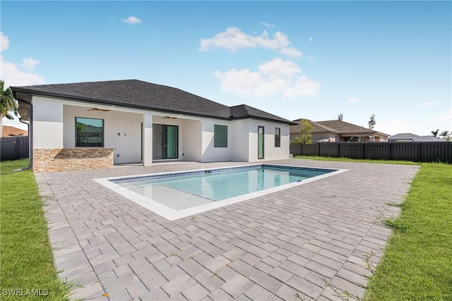 view of pool with ceiling fan, a patio area, fence, and a fenced in pool