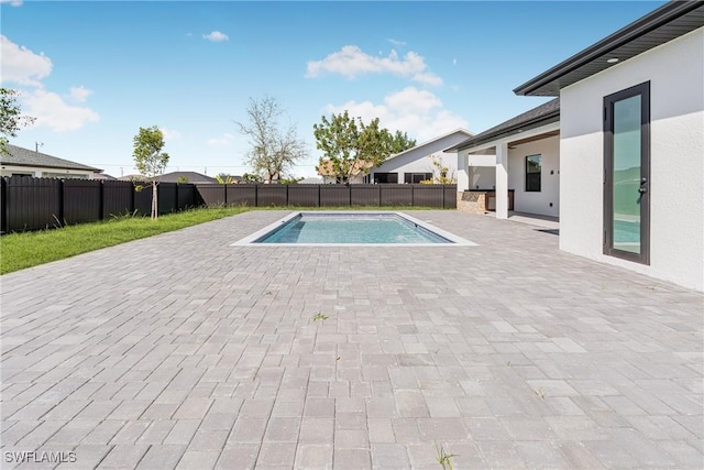 view of swimming pool with a fenced backyard, a fenced in pool, and a patio