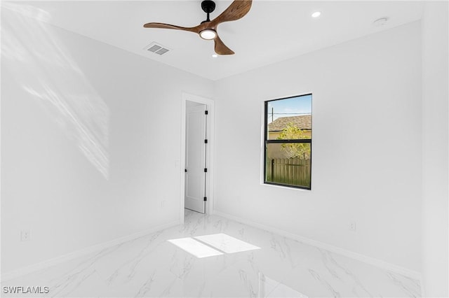 empty room with baseboards, visible vents, a ceiling fan, marble finish floor, and recessed lighting