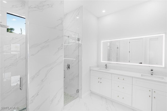 bathroom featuring marble finish floor, a sink, and a marble finish shower