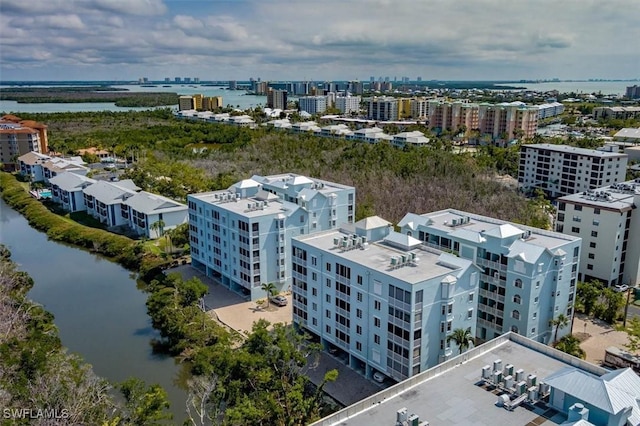 bird's eye view featuring a water view and a city view