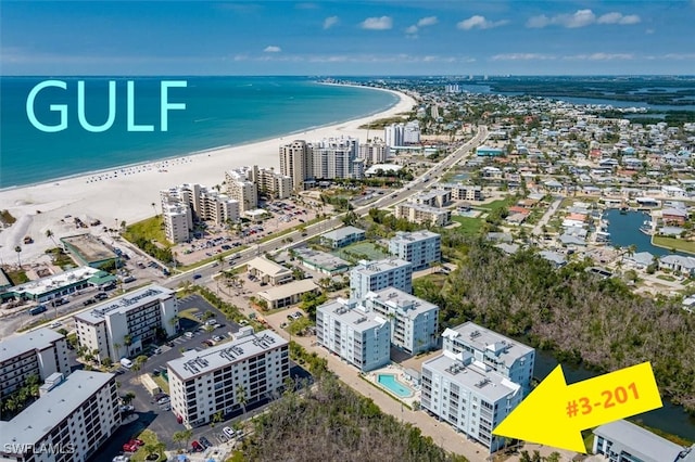 aerial view with a view of the beach, a water view, and a city view