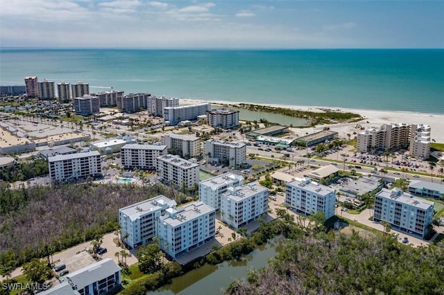 birds eye view of property with a view of city and a water view