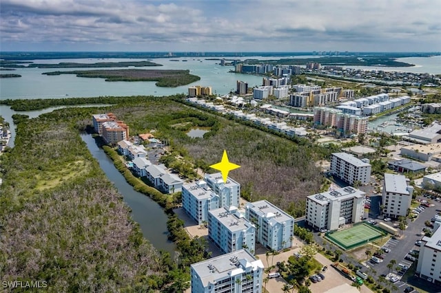 birds eye view of property featuring a water view and a city view