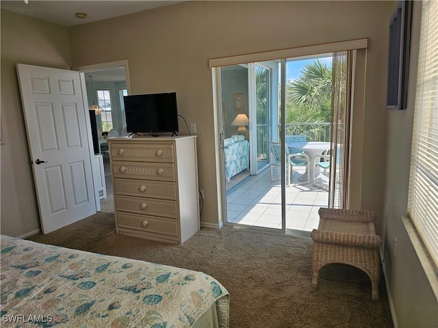 bedroom with carpet flooring and access to exterior