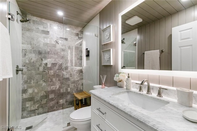 bathroom featuring a stall shower, toilet, wooden ceiling, vanity, and tile walls