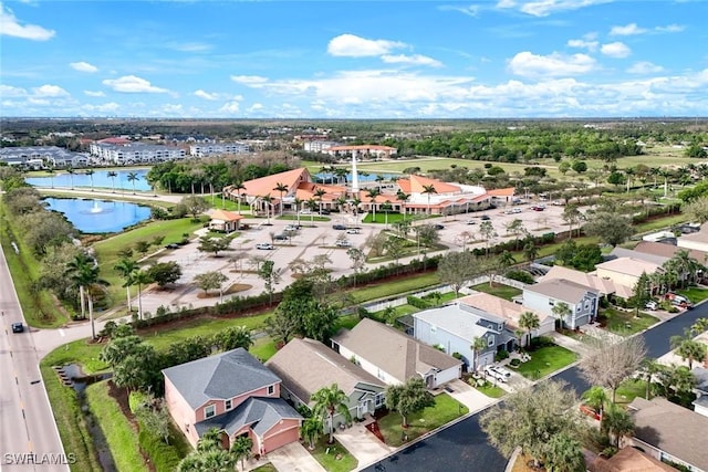 bird's eye view featuring a water view and a residential view