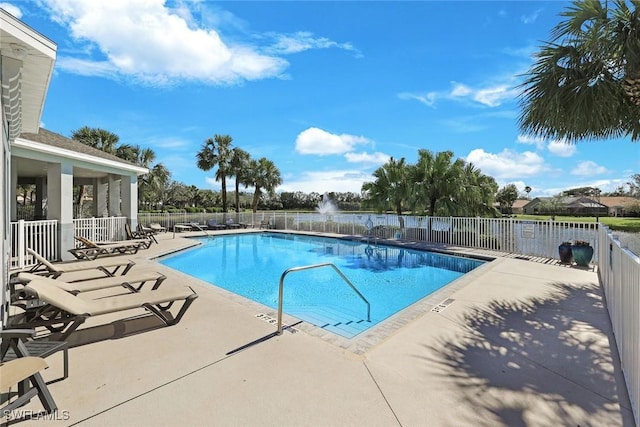 pool featuring a patio area and fence