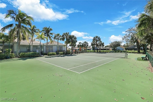 view of sport court featuring fence