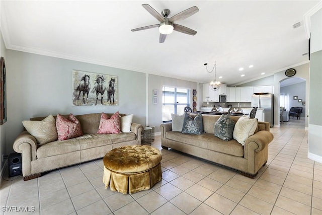 living room featuring light tile patterned floors, arched walkways, lofted ceiling, ornamental molding, and ceiling fan with notable chandelier